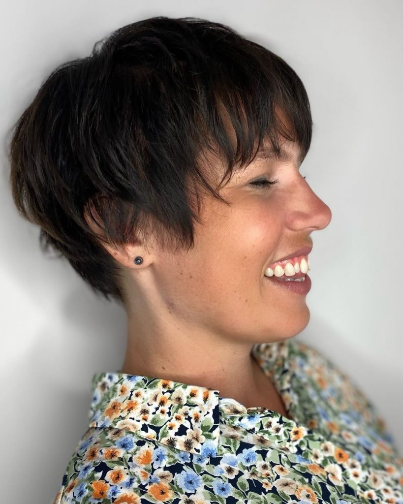 Pixie cut with full wispy bangs