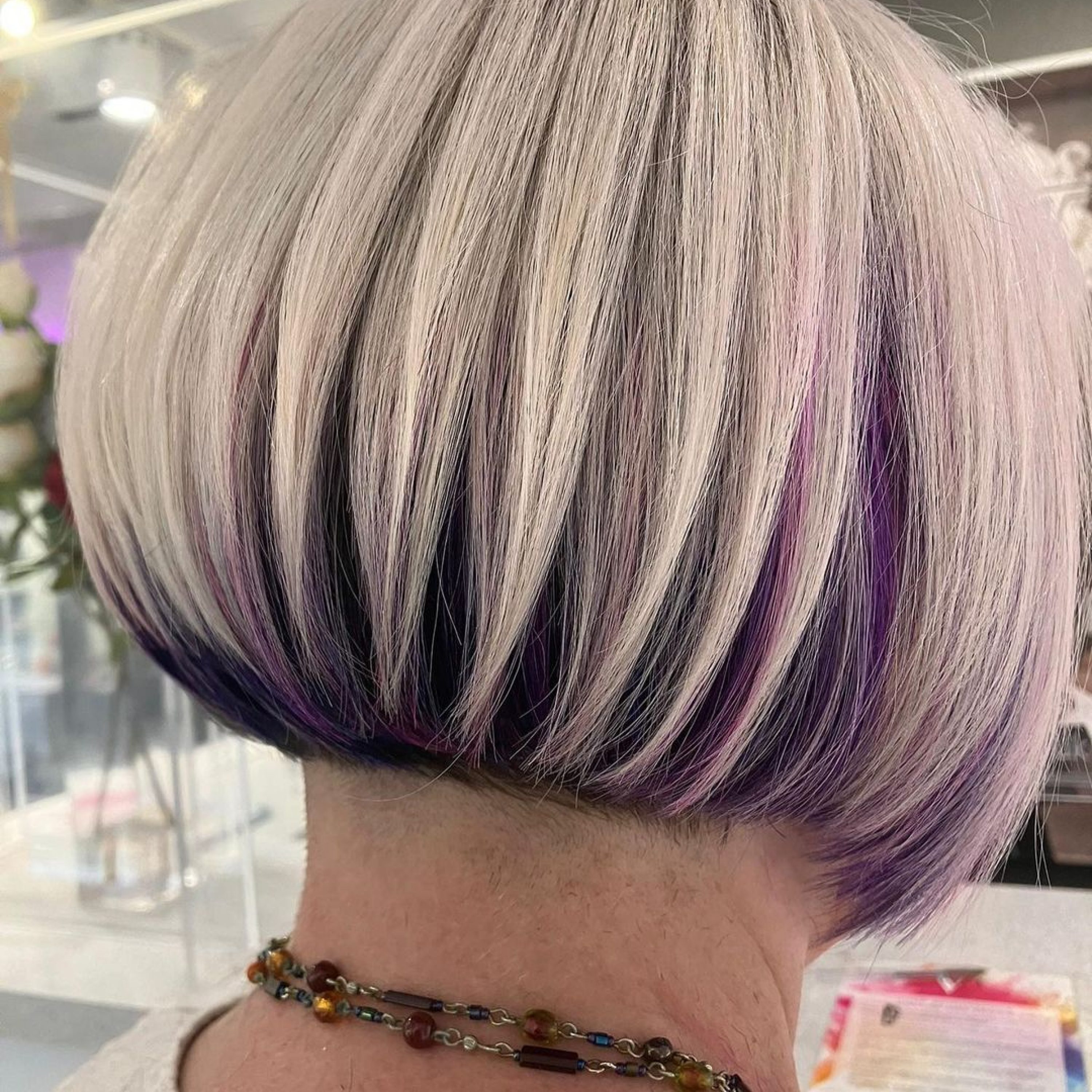 short blonde bob with purple underdye