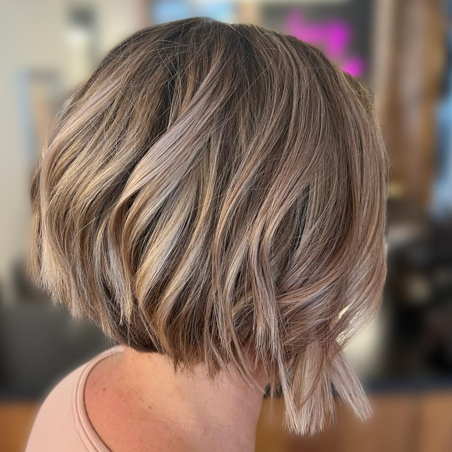 inverted blonde bob with lowlights