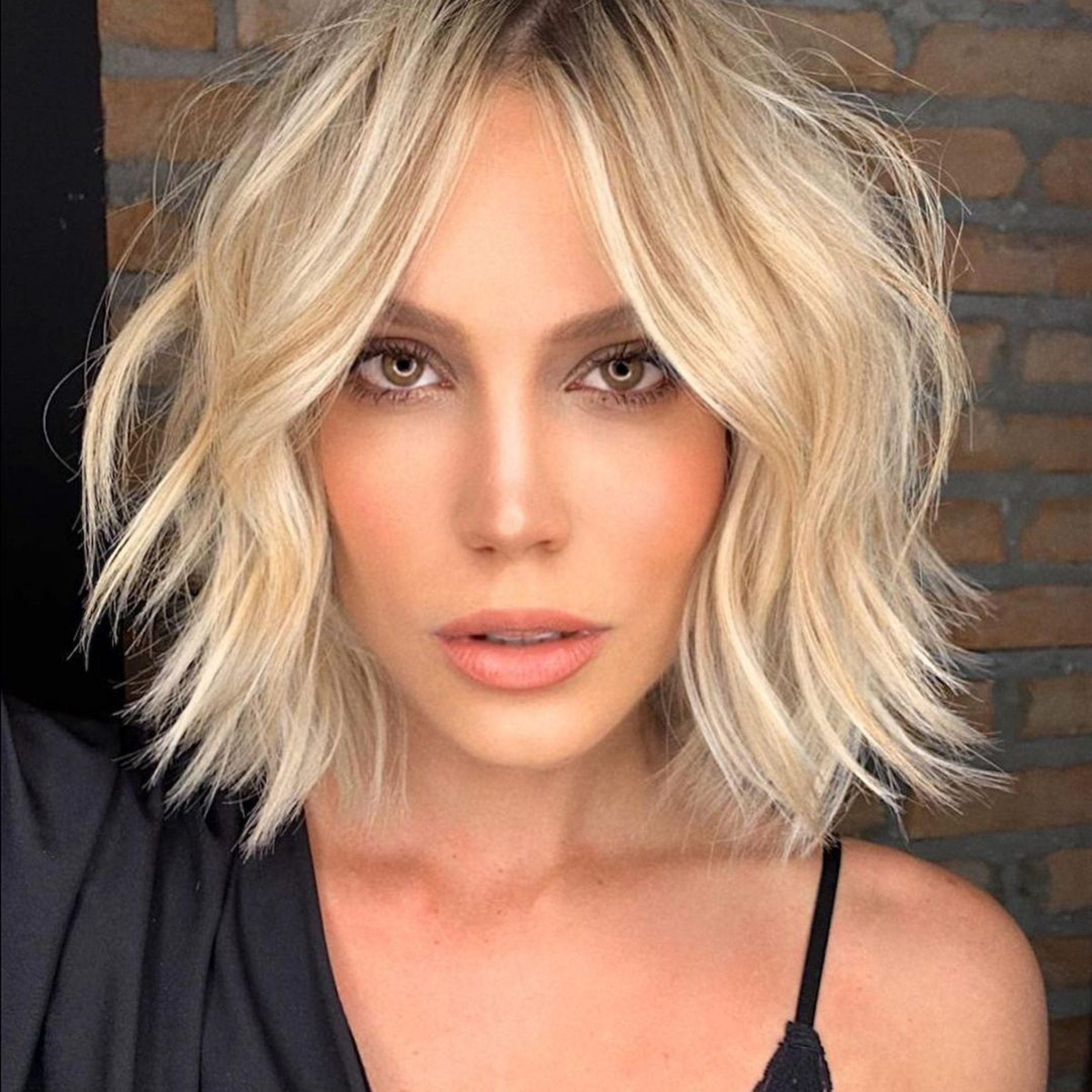 layered blonde bob with curtain bangs