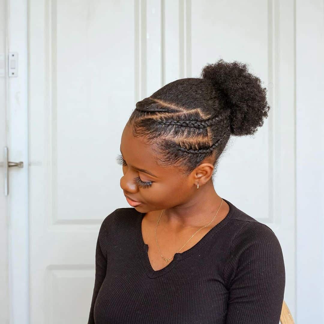 high curly bun with asymmetric braids