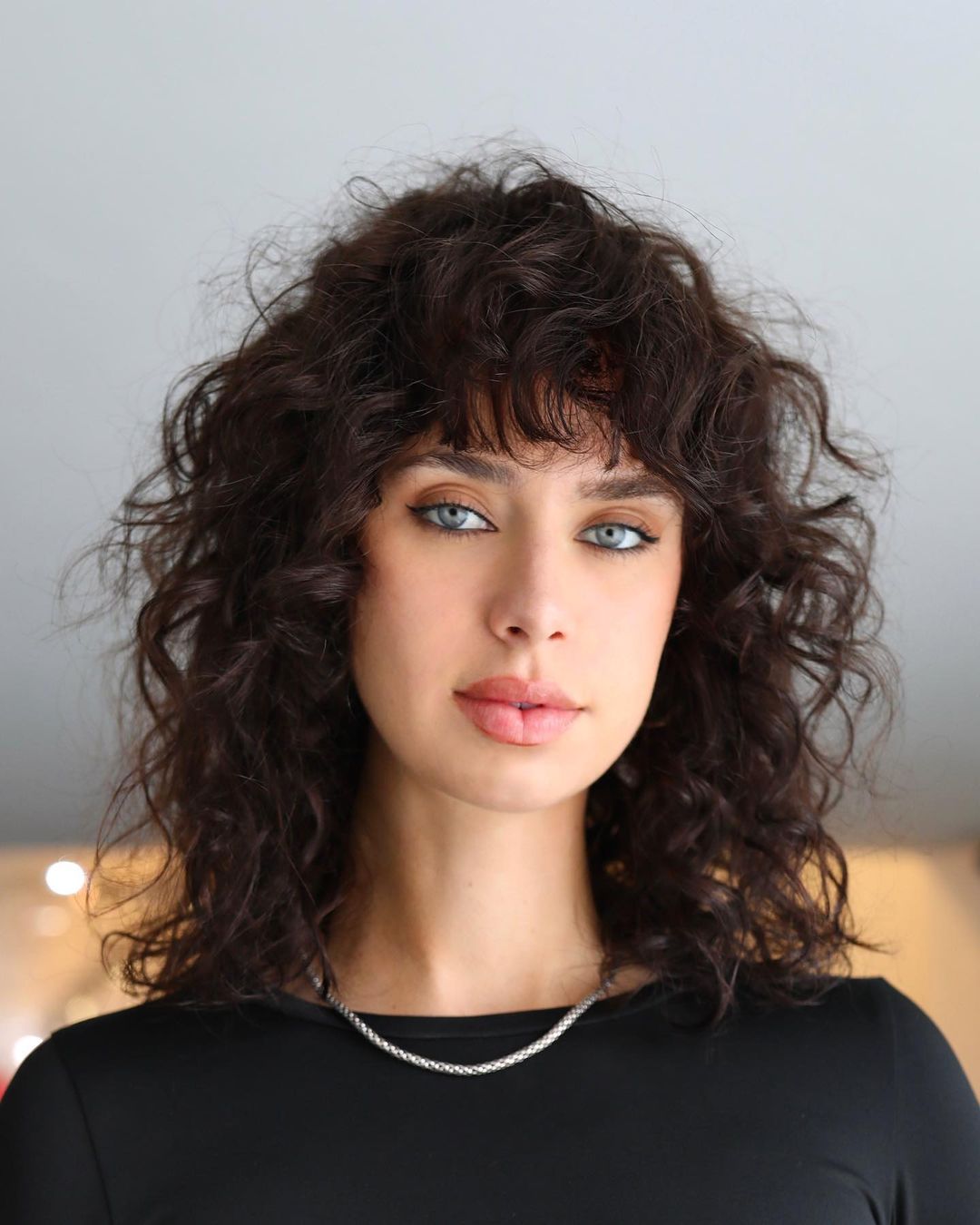 curly medium hair with bangs