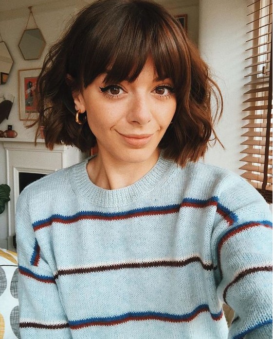 a short brunette bob with waves and bangs is a lovely and very girlish idea for any time