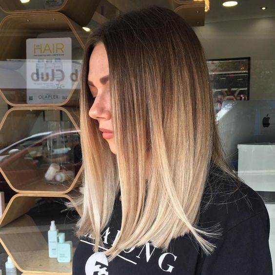 beautiful medium-length hair from brown to bleached blonde, straight but with volume, is a stunning idea