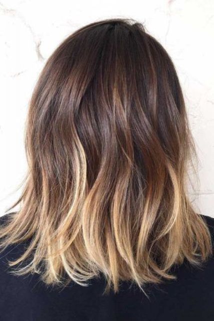 messy medium-length ombre hair from dark brown to blonde and with messy waves, is a lovely idea to rock