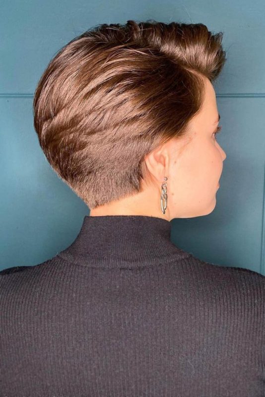 a brown long pixie on thick hair, the short length and stacked effect are a great combo for anyone with such hair