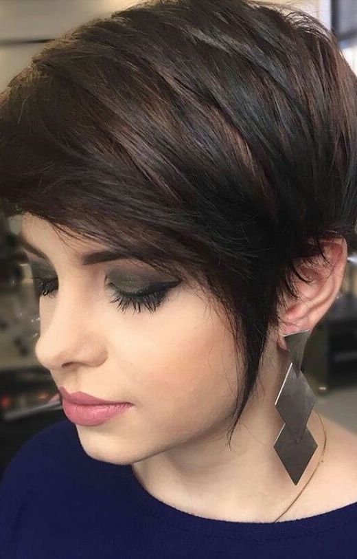 a long dark pixie haircut with black balayage on chestnut hair