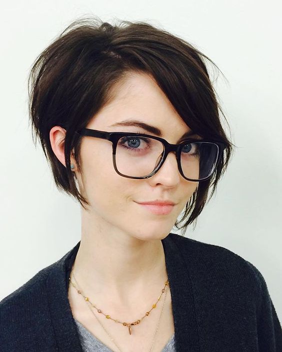 a longer pixie haircut with bangs looks very cute and textural