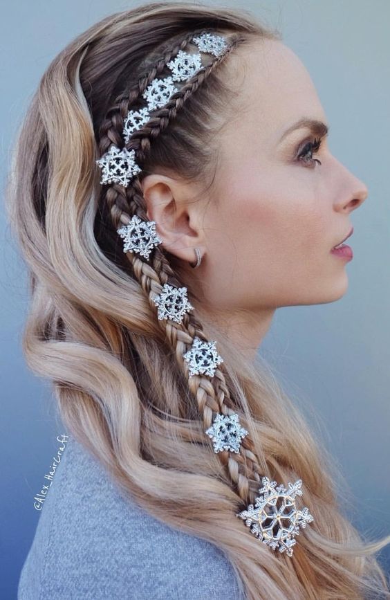 a unique half updo with two side braids and little snowflakes plus waves down is a cool idea for the holidays