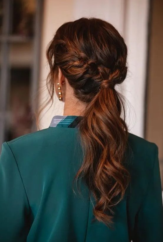 a beautiful low ponytail with a braided halo and some face-framing locks is a cool idea for a cool and catchy look