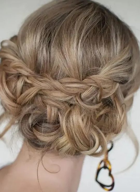 a boho updo with braids and twists and some waves down plus a bump on top is a stylish and cool idea