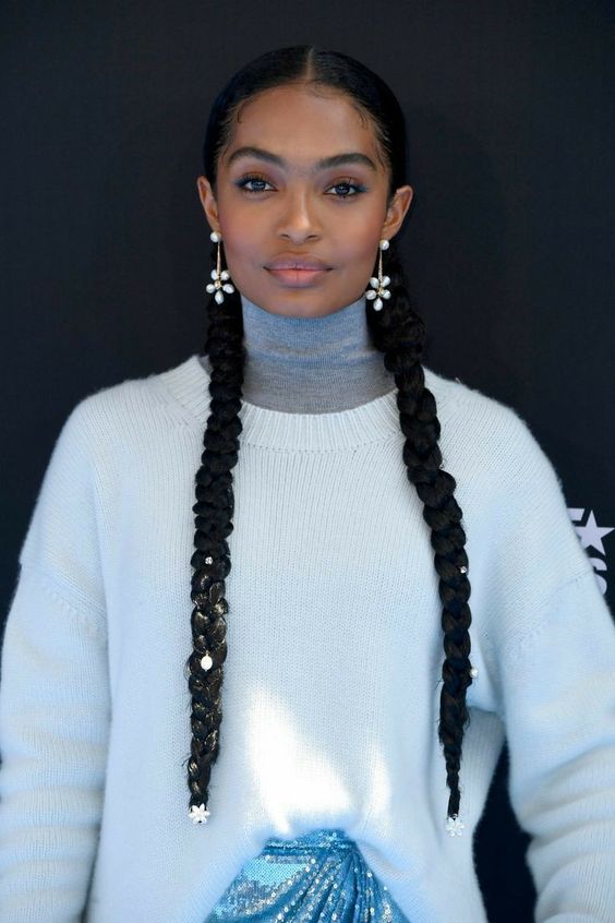 two long braids accented with pearls and pearl earrings are a great hairstyle for Christmas