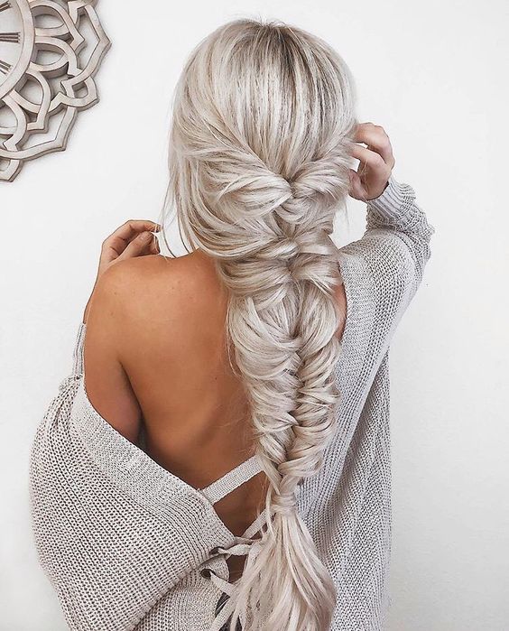 a jaw-dropping twisted and fishtail braid with bangs is a wow statement for any party