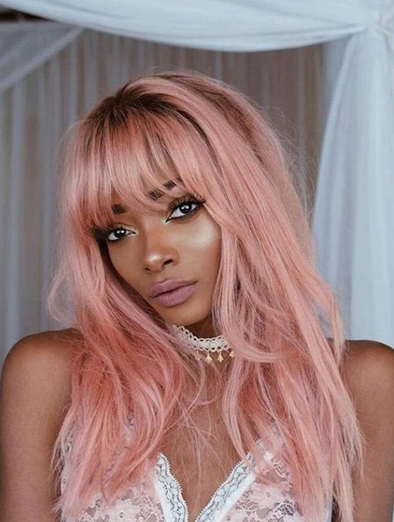 long pastel pink hair with much texture, with bangs and layers is a very beautiful and candy-like idea