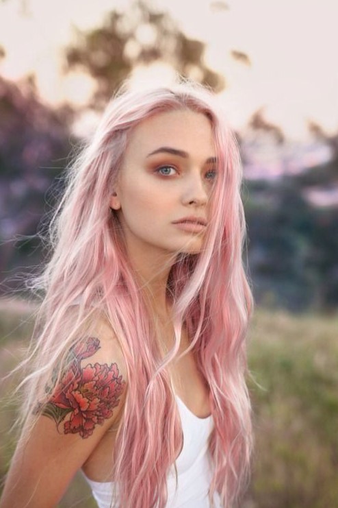 long wavy pastel pink hair with much texture and a pink smokey eye to finish off the look