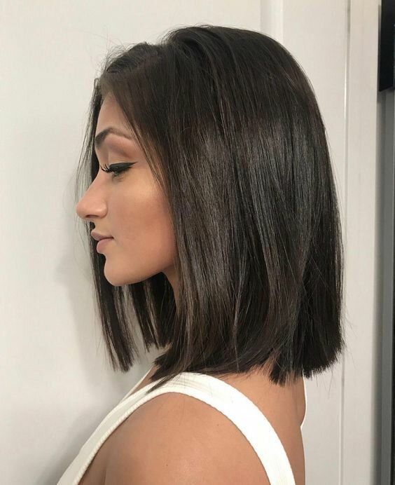 a dark brunette shoulder-length blunt bob is a stylish idea to rock, and such a shiny finish is perfect