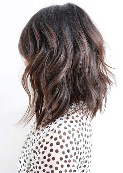 a layered textural dark brunette bob with chestnut highlights and shaggy waves is a stylish solution