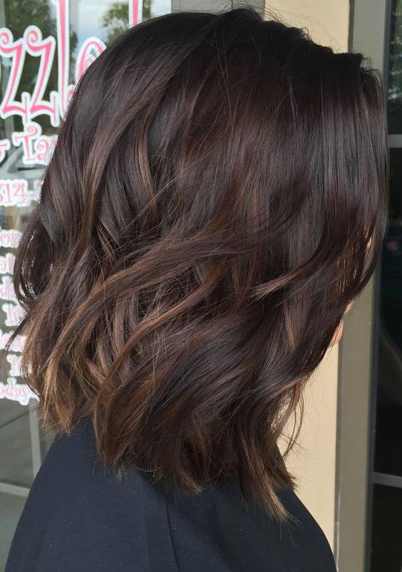 a dark brown wavy bob with caramel highlights is a lovely and chic idea that looks effortless and awesome