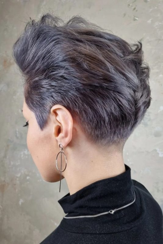 a lilac long pixie looks super bold due to the shaved sides, and its styling can be very versatile