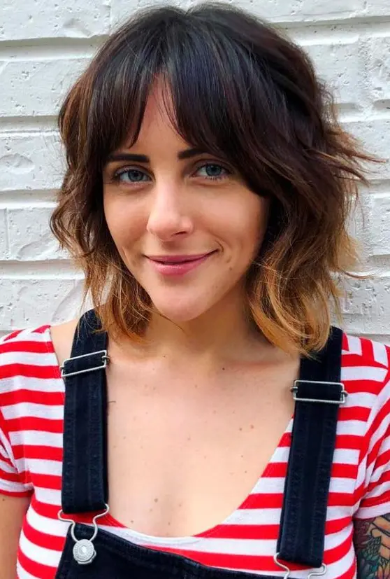 a catchy dark brunette long bob with bottleneck bangs and caramel ombre plus shaggy waves is a cool idea